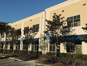 handicapped parking in front of some offices connected to a business center