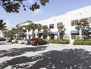 handicapped parking in front of some offices connected to a business center